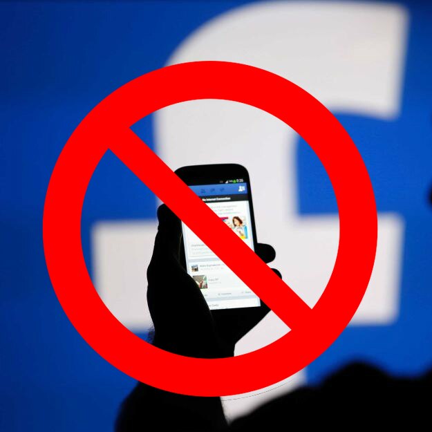 Man using Facebook with a ban symbol