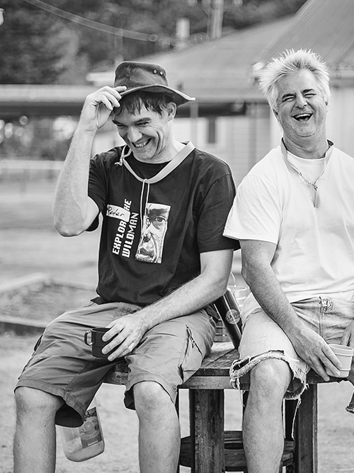 Black and white photo of laughing men - Men with Heart exhibition