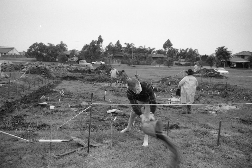 A black-and-white photo of an archaeological excavation site
