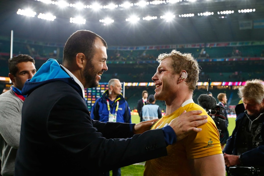 Wallabies coach Michael Cheika and David Pocock after the Rugby World Cup semi-final against Argentina