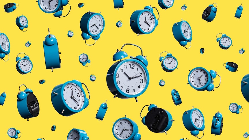 many light blue alarm clocks falling against bright yellow background