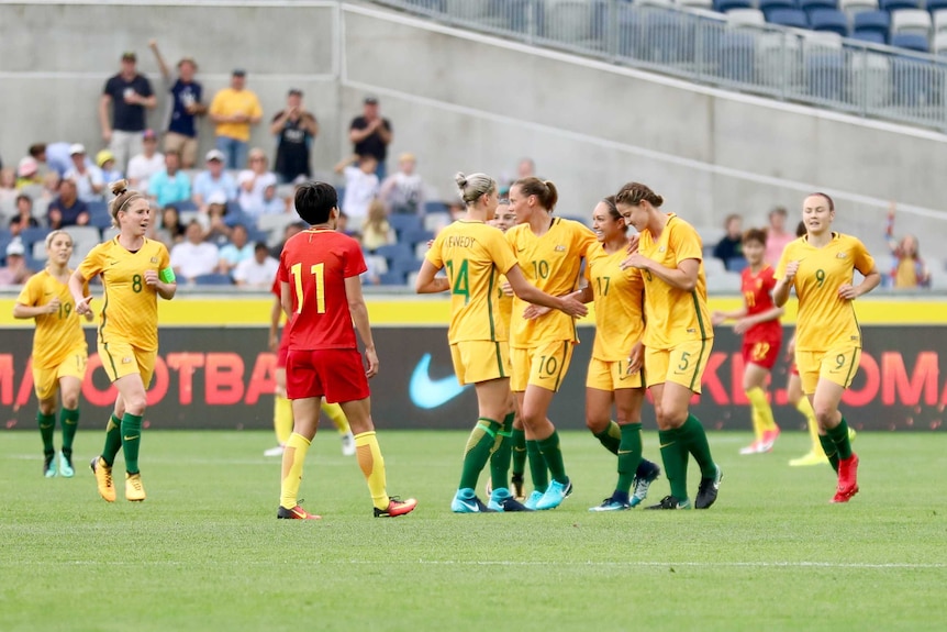 Matildas congratulate Kyah Simon (#17) after her goal against China at Geelong on November 26, 2017.