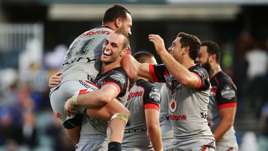 Bodene Thompson of the Warriors celebrates his golden point try