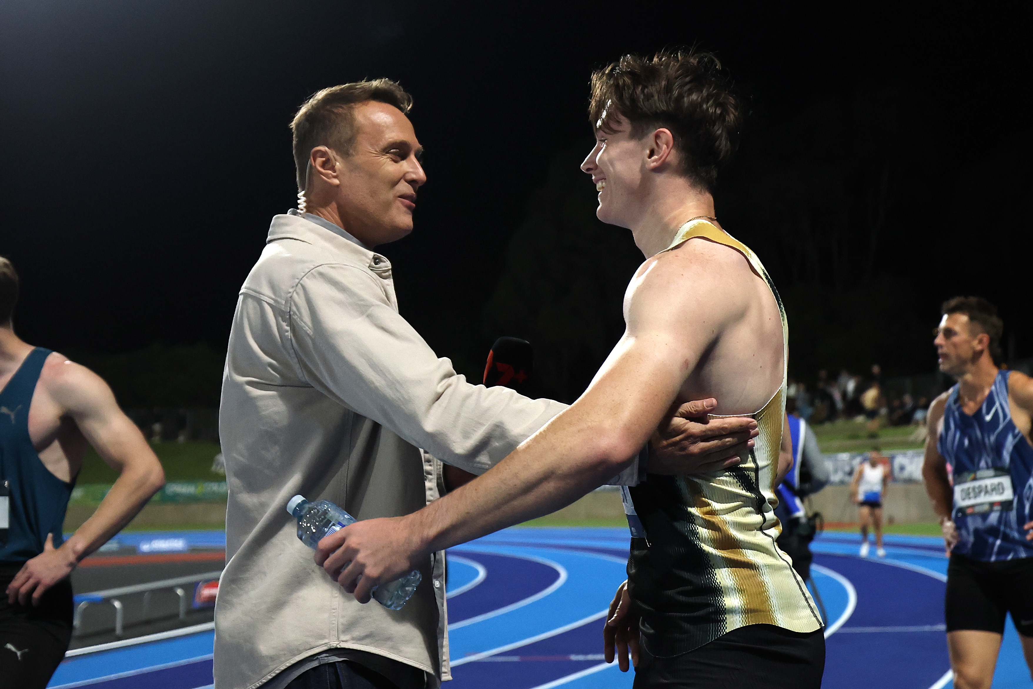 Lachlan Kennedy speaks to Matt Shirvington after a race.