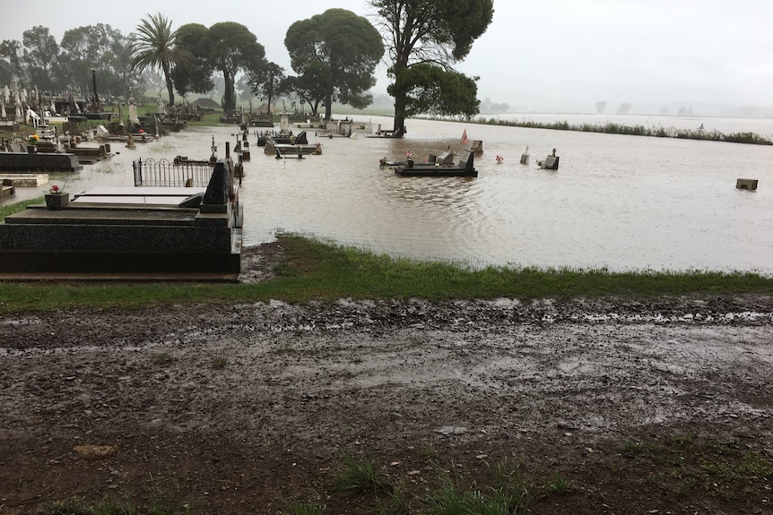 Graves inundated with floodwater