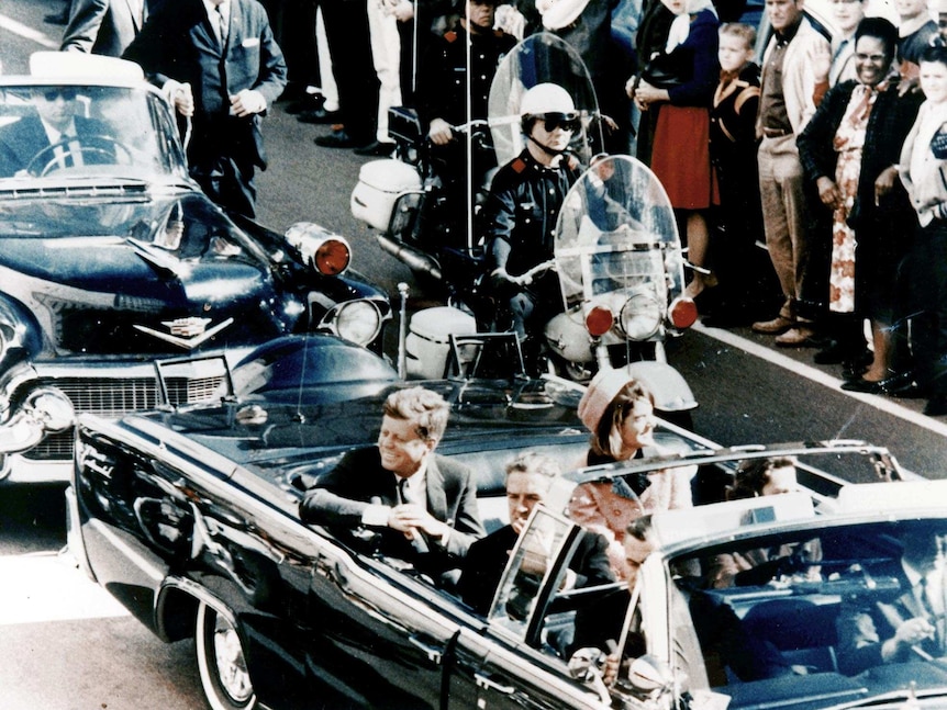 JFK and Jackie in the limousine as it makes its way through Dallas.