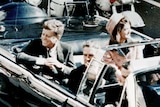 JFK and Jackie in the limousine as it makes its way through Dallas.