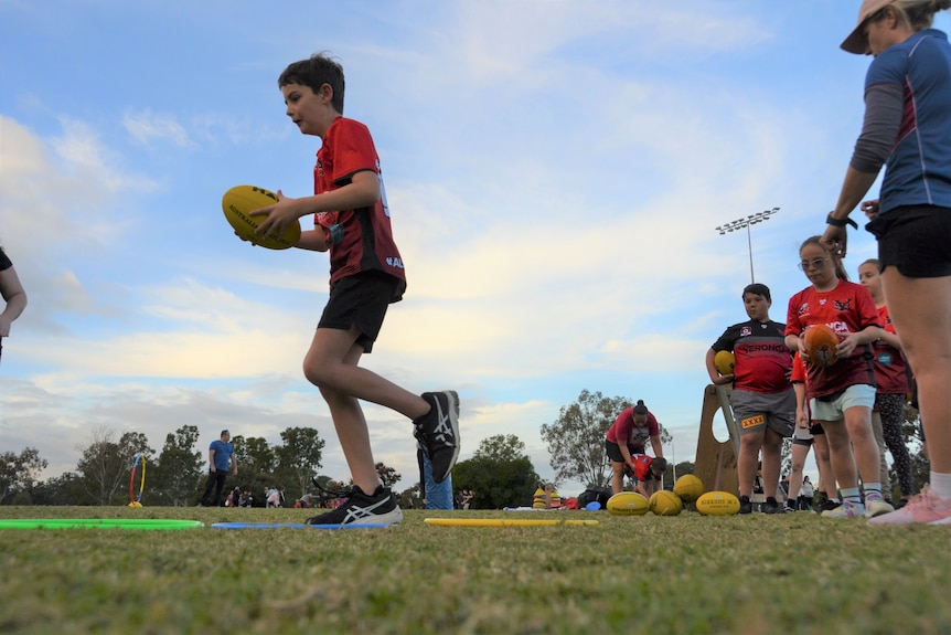Children playing Auslan Aussie rules football at Yeronga South Brisbane Devils AFL club