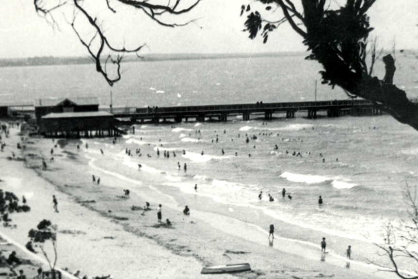 A black and white photo of the Shorncliffe Pier as it was in the 1930s.