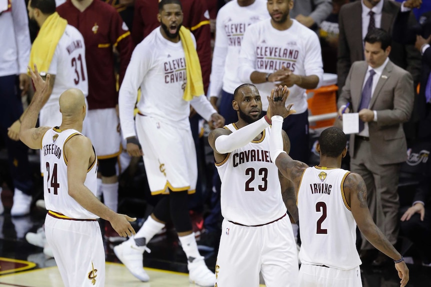 Cleveland Cavaliers' LeBron James and Kyrie Irving celebrate in game four of the NBA Finals