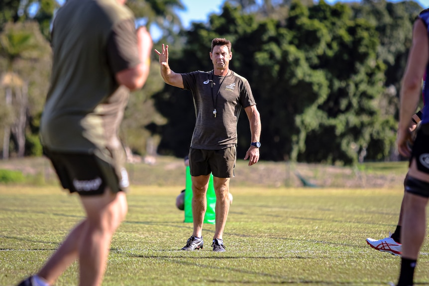 Wallabies assistant coach Scott Wisemantel gestures with his hand at training before a rugby union Test against France.