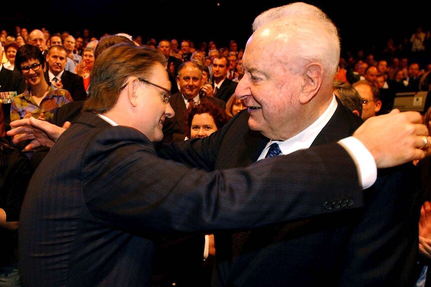 Mark Latham hugs Gough Whitlam during the 2004 election Labor campaign launch.