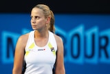 Jelena Dokic looks off to the side with a blank expression during a women's singles match.
