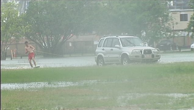 Cyclone threat moves on but Darwin hit by deluge.