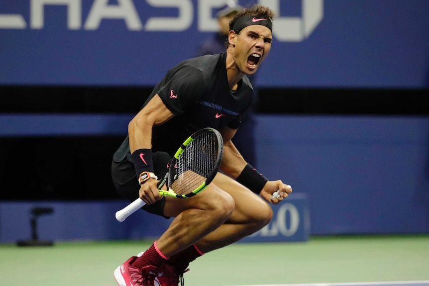 Rafael Nadal begins to drop to the court, as he celebrates beating Juan Martin del Potro at US Open.