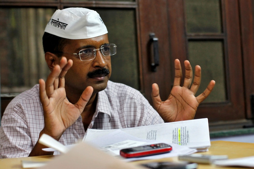 An Indian man speaking during an interview. 