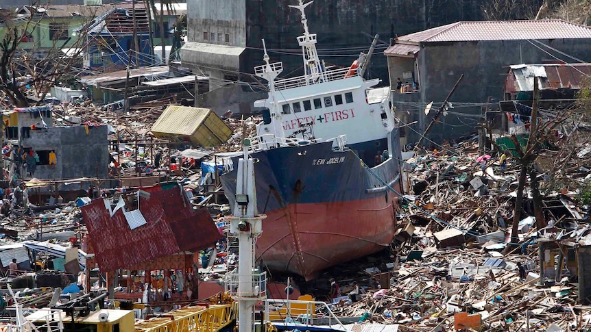 A cargo ship washed ashore by Typhoon Haiyan sits among the ruins of Tacloban.