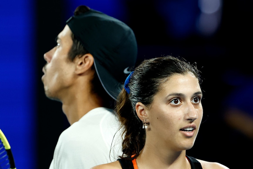 Two Australian mixed doubles players on court during Australian Open final.