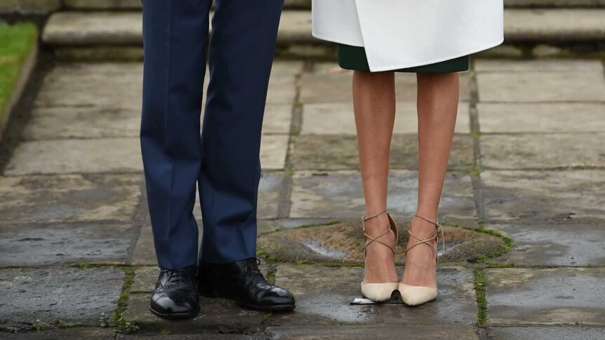 Britain's Prince Harry poses with Meghan Markle in the Sunken Garden of Kensington Palace, London, Britain, November 27, 2017.