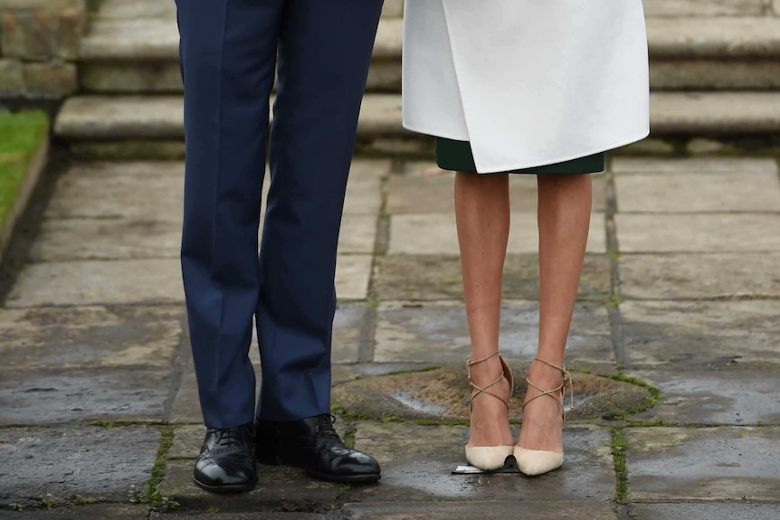 Britain's Prince Harry poses with Meghan Markle in the Sunken Garden of Kensington Palace, London, Britain, November 27, 2017.