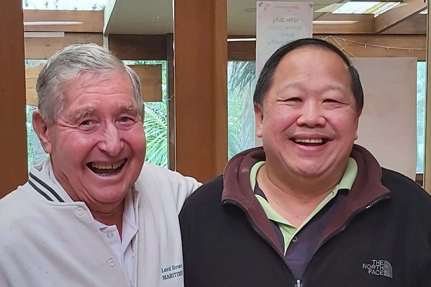 87-year old Clive Wilson and local cafe operator Stephen Sia