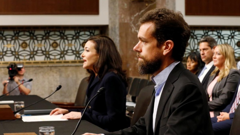 Twitters' chief executive Jack Dorsey and Facebook's chief operating officer Sheryl Sandberg testifying before US lawmakers.
