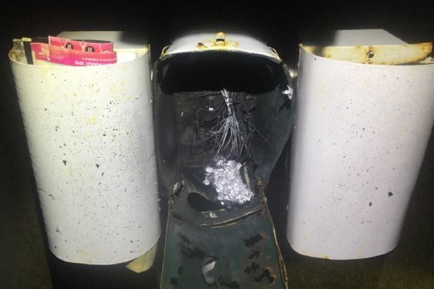 A letterbox is extensively damaged by an explosive device.