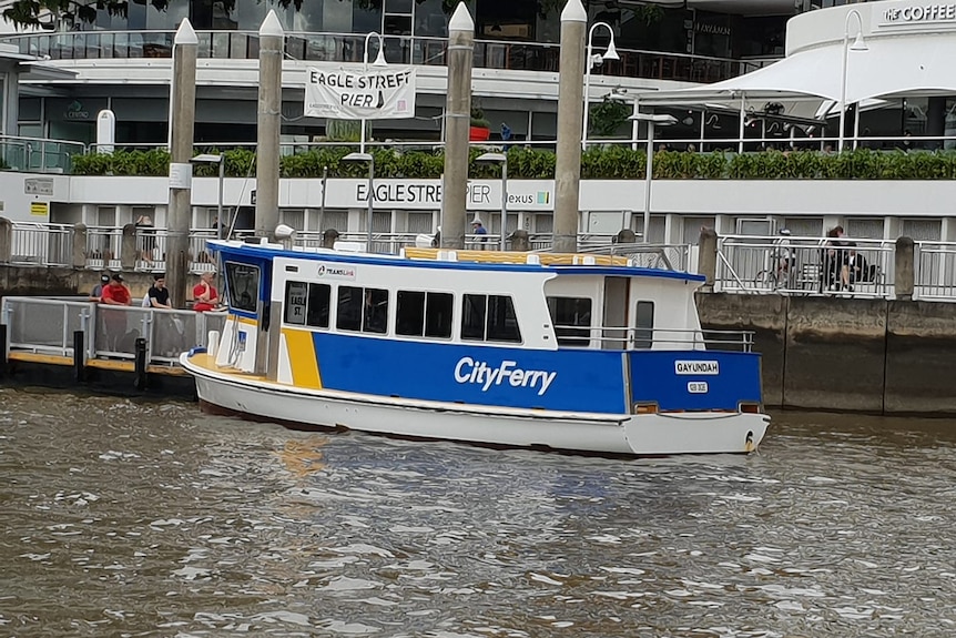 A ferry docked at a city terminal