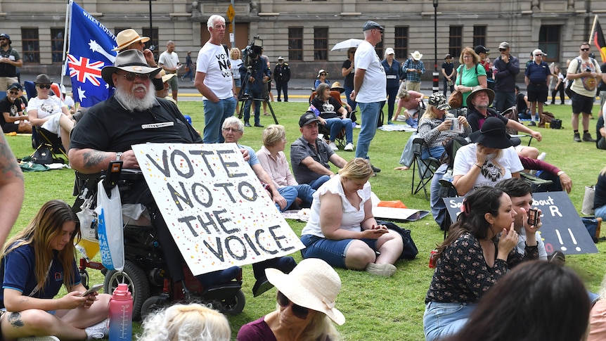 People take part in a rally against the voice to parliament in Brisbane