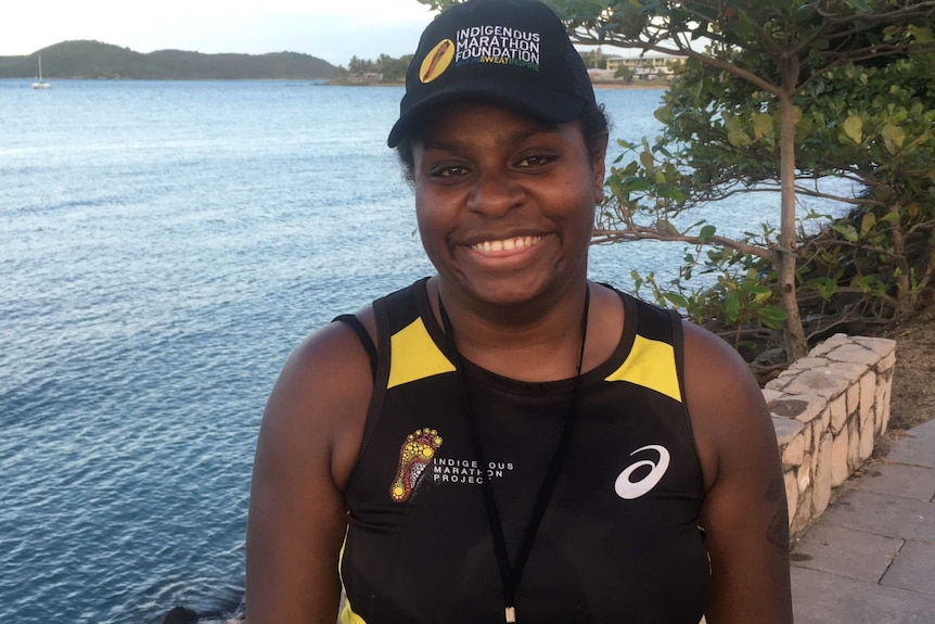 An indigenous marathon runner is photographed on the foreshore at Thursday Island