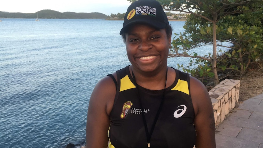 An indigenous marathon runner is photographed on the foreshore at Thursday Island