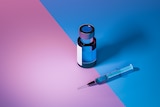 Single syringe and dose of vaccine on blue/pink background.