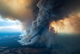 A supplied image shows smoke billowing from a fire burning at East Gippsland.