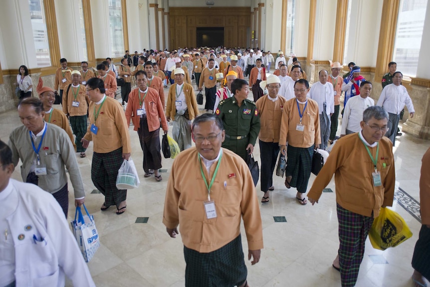 Myanmar's parliamentary members leave the parliament's regular session in Naypyidaw