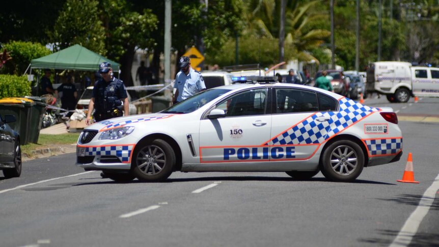A police car blocks of a street in the Cairns suburb of Manoora.