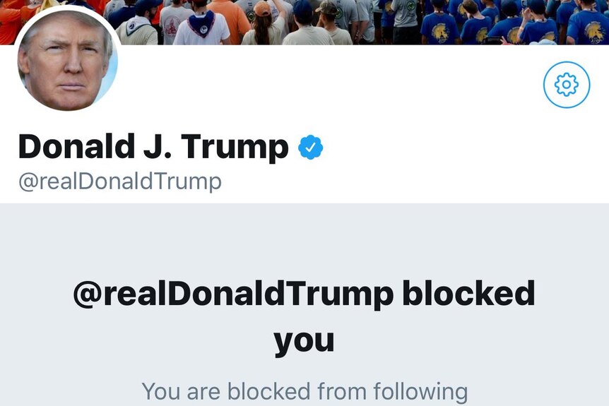 A screenshot of Donald Trump's twitter account with a message saying "@realDonaldTrump blocked you".