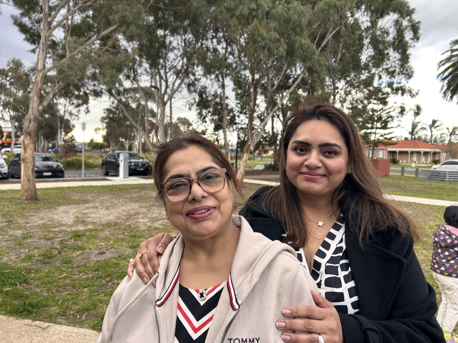 mother and daughter looking into camera