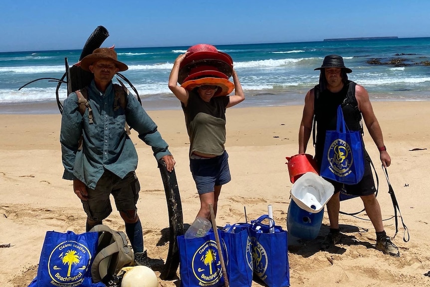 People collecting Fishing buckets and other plastic waste.