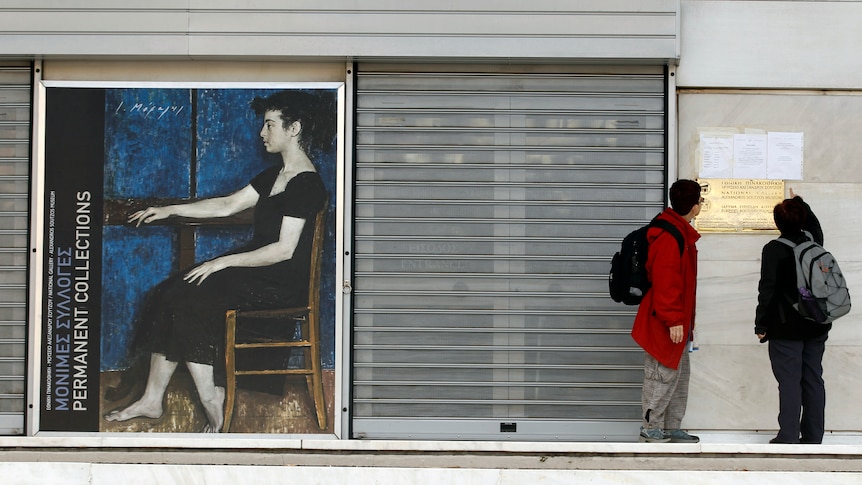 Tourists stand outside the closed doors of Greece's National Gallery in Athens