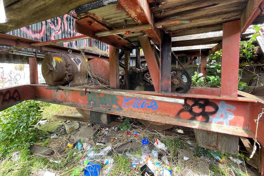 A turntable control box with a lot of litter strewn around it.