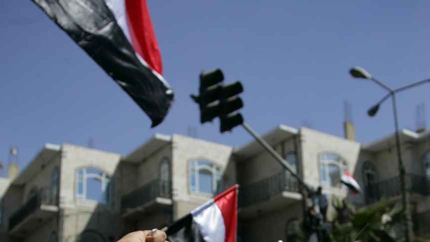 Opposition supporters shout during an anti-government protest in Sanaa