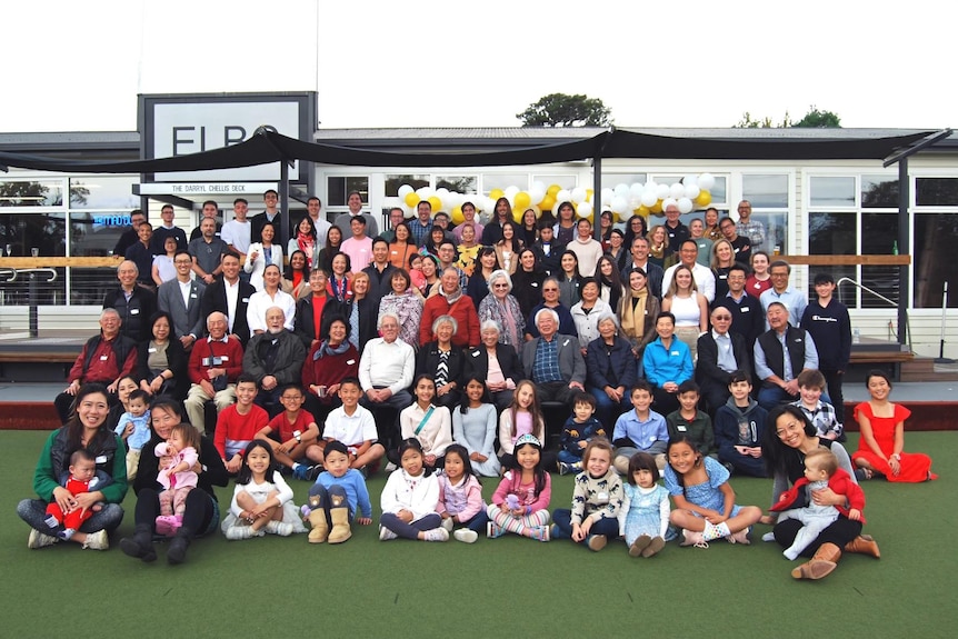 Group photo of over 100 people of mixed ages