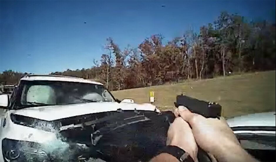 Body cam video shows US police officer rammed by stolen car - ABC News