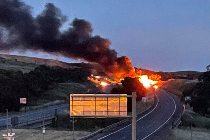 Flames and smoke on a freeway 
