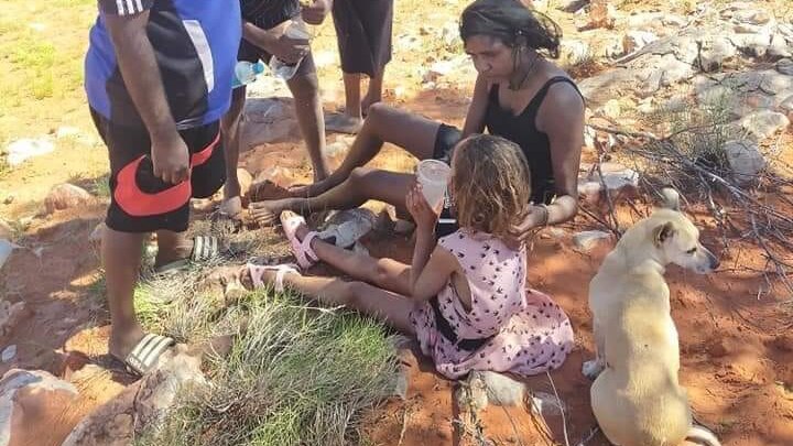 Community rejoices after missing girl found in desert sitting with her puppy