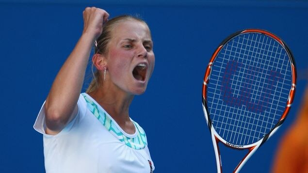 Jelena Dokic celebrates winning a point during her first-round Australian Open match