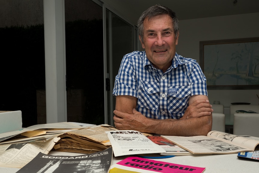 Owen Mace looks over some of the rocket launch memorabilia.