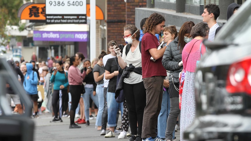 A line stretches back as far as the eye can see outside Centrelink.