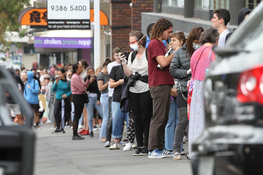 A line stretches back as far as the eye can see outside Centrelink.