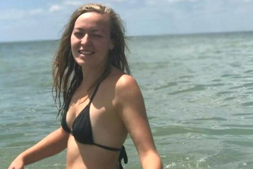A woman in a bikini in the ocean.